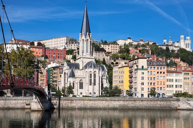 View of Lyon city with red footbridge on Saone river