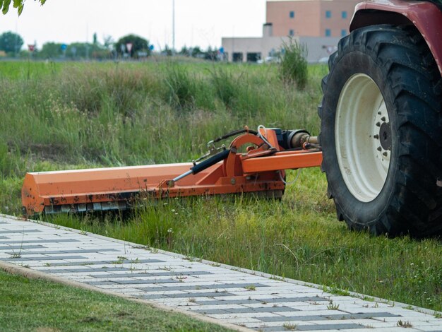 View of machinery on field by road