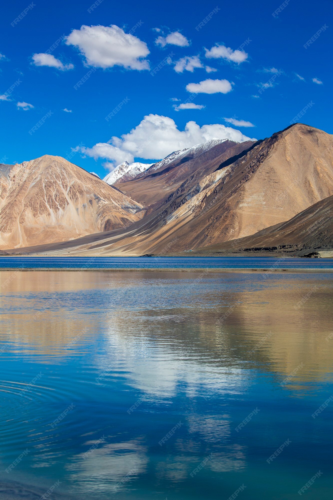 Premium Photo | View of majestic rocky mountains against the blue sky and  lake pangong in indian himalayas, ladakh region, jammu and kashmir, india.  nature and travel concept