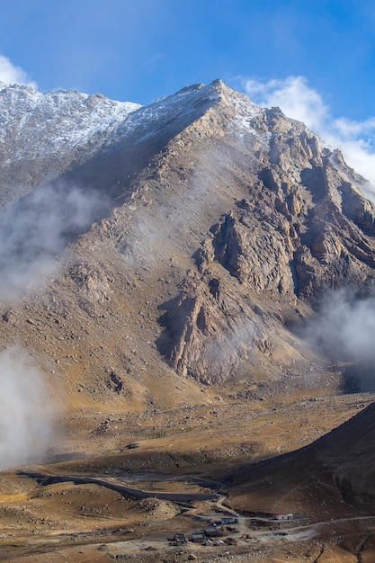 View of majestic rocky mountains against the blue sky and white clouds in Indian Himalayas, Ladakh region, India. Nature and travel concept