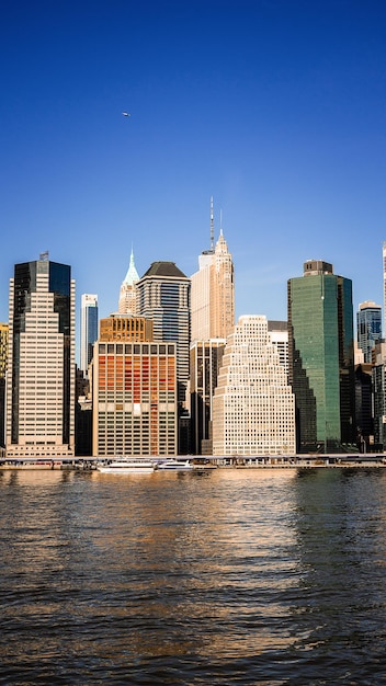 A view of the manhattan skyline from the east river.