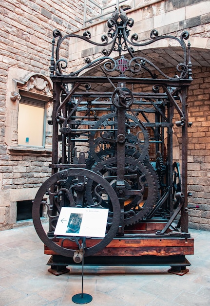 Photo view of the mechanism of the turret clock in museum clockwork mechanism of church clock tower photo