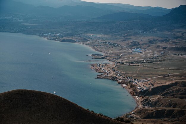 View of Meganom beach on the Black Sea coast from the top of the mountain on Cape Meganom