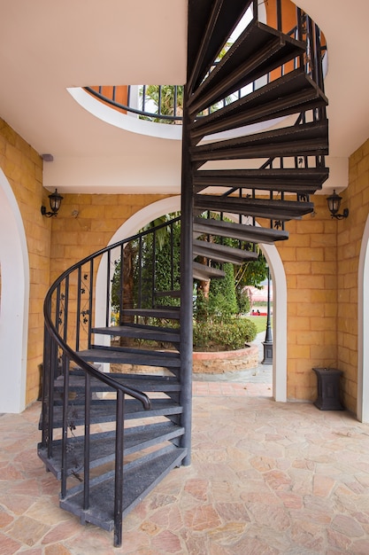 View of a metal dark spiral staircase