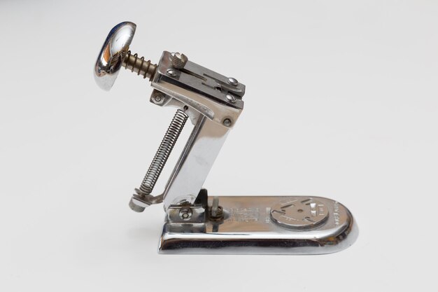 View of a metal stapler on white background