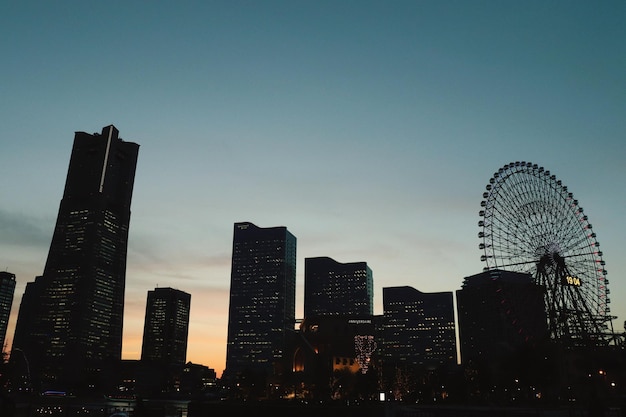 Photo view of modern buildings against sky during sunset