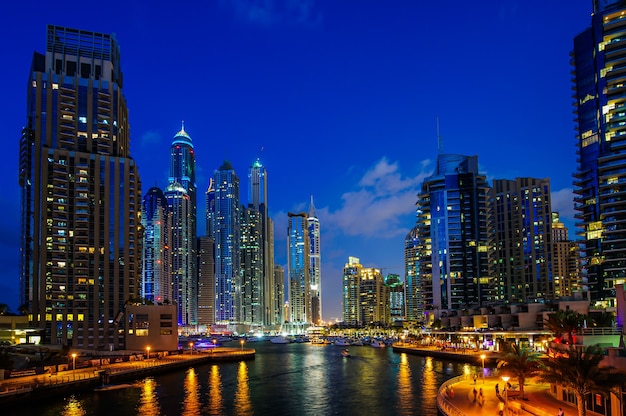 View of modern skyscrapers in Jumeirah beach residence in Dubai, JBR - artificial canal city, carved along a 3 km on Persian Gulf shoreline.