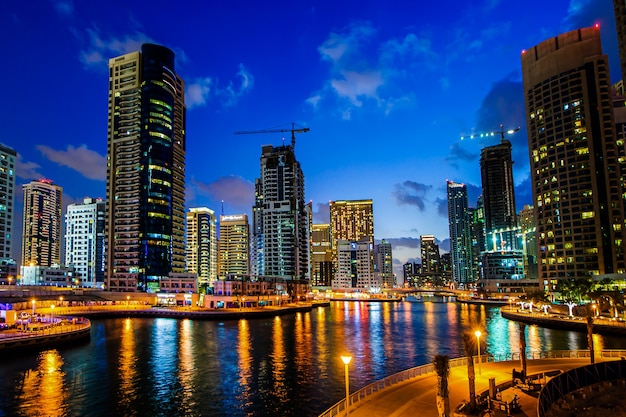 View of modern skyscrapers in Jumeirah beach residence in Dubai, JBR - artificial canal city, carved along a 3 km on Persian Gulf shoreline.