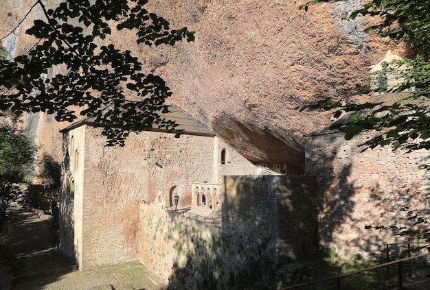 View of the monastery of San Juan de la Pea under a large rock in Huesca Aragon Spain