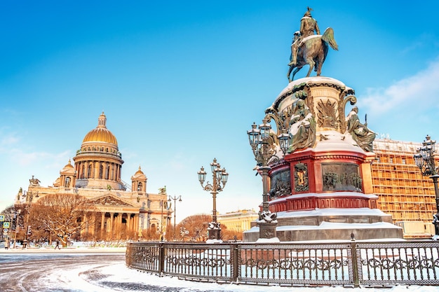 View of the monument to Nicholas and St Isaacs Cathedral on a snowy winter day in St Petersburg