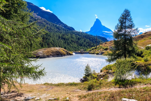 View of Moosjisee lake and Matterhorn mountain at summer on the Five Lakes Trail in Zermatt Switzerland