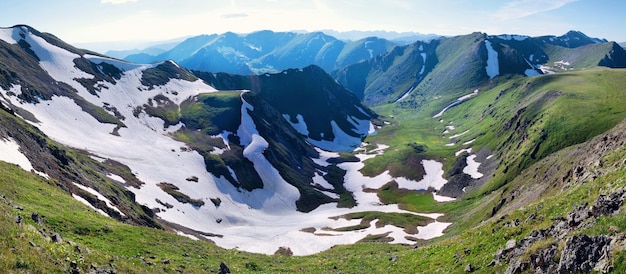 View of the mountain gorge from the top snow and rocks