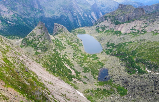 View of the mountain valley from the pass in Sayan Mountains in Siberia