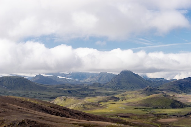 View mountain valley with green hills, river stream and lake