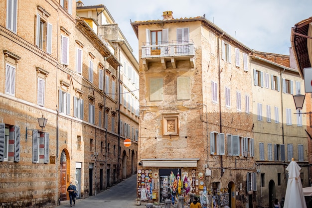 View on narrow and cozy street in siena italy