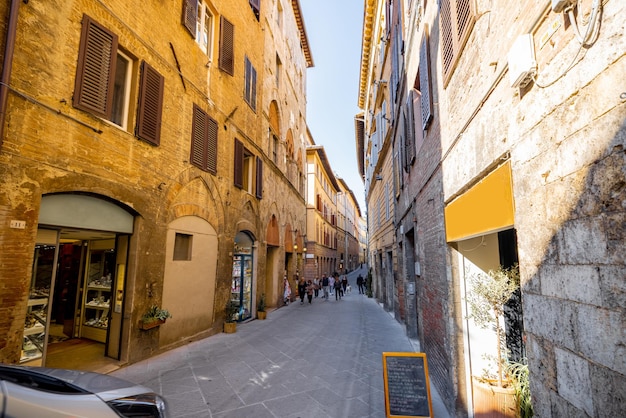 View on narrow and cozy street in siena italy