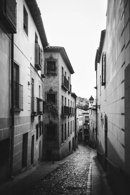 View of narrow street between old residential building