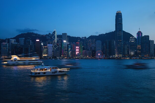 View of the  night modern city. Hong Kong from the Victoria Harbour.