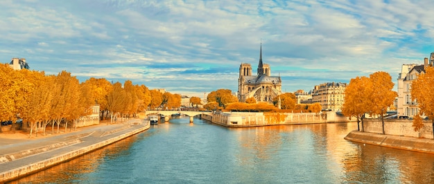 View of Notre Dame de Paris and Seine river in Autumn