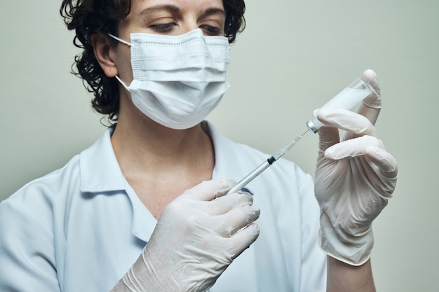 View of a Nurse preparing vaccine dose.