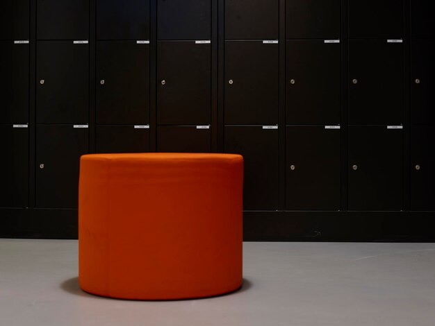 Photo view of orange table against lockers