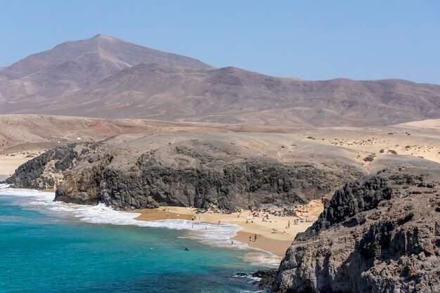 View of people at playa del pozo pozo beach lanzarote canary islands spain