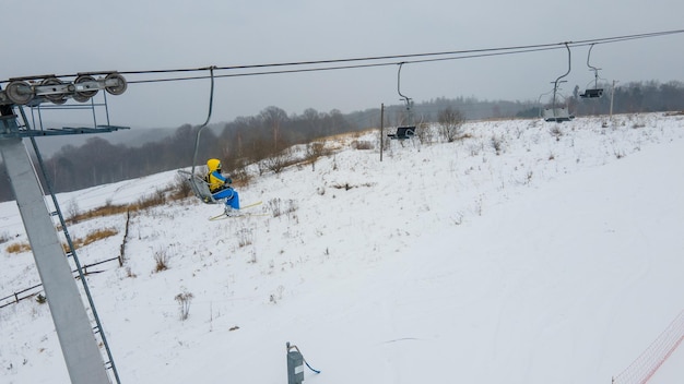 View of people at ski lift chair winter season