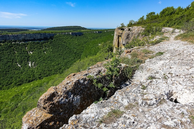 Вид на живописные крымские горы из пещерного городка ТепеКермен в летнем Крыму
