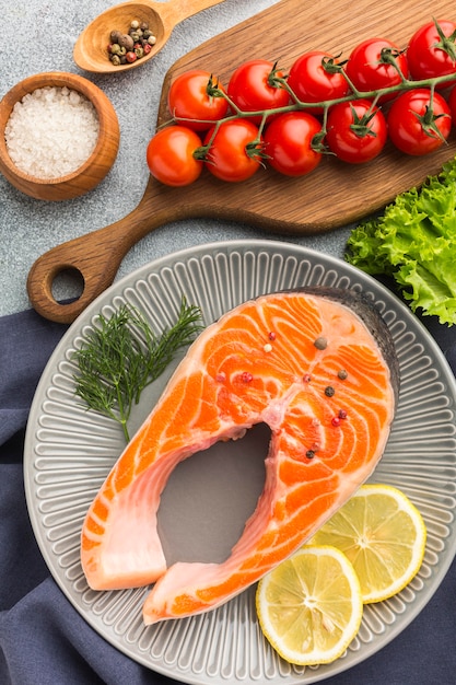 above view plate with salmon and lemon