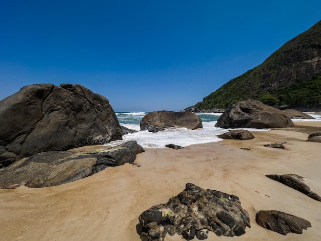 View of Prainha Beach a paradise in the west side of Rio de Janeiro Brazil Big hills around Sunny day