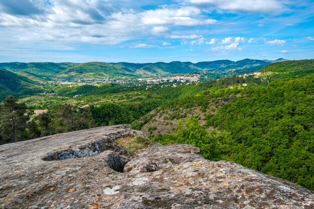 View on Privas and the Ardeche plateau from a sandstone plateau near La Jaubernie caves in Coux