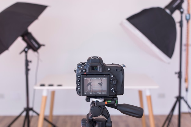 View of professional modern camera screen on tripod