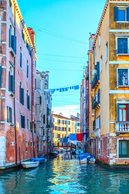 View of pucturesque side canal in Venice in the evening, Italy