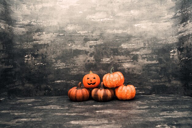 View of pumpkins on table against wall