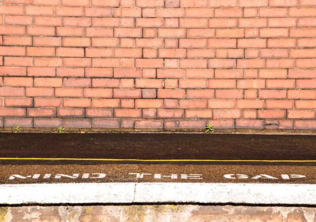 View of railroad tracks against wall