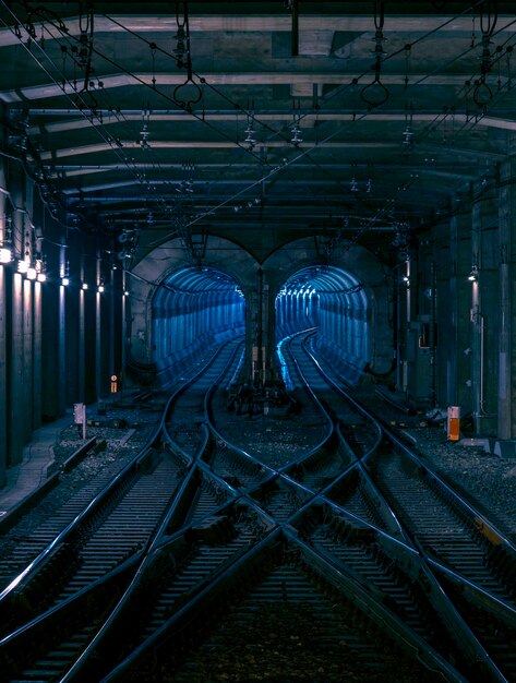 Photo view of railroad tracks in tunnel