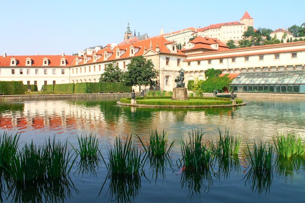 View of reflection in a lake in Wallenstein Garden its statues and fountain Prague Chezh Republic