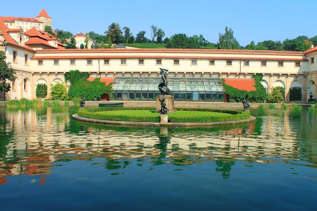 View of reflection in a lake in Wallenstein Garden its statues and fountainPrague Chezh Republic