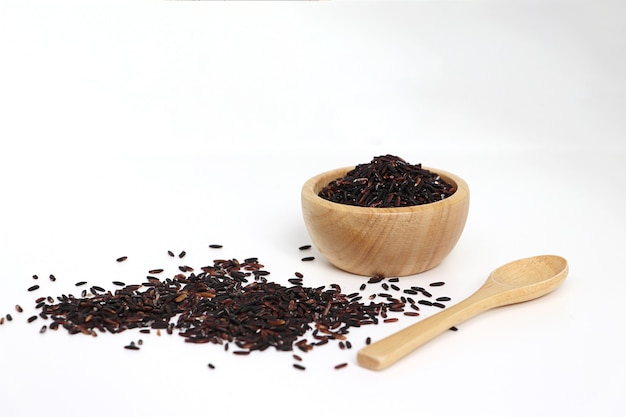 View of Riceberry with wooden bowl on white background.