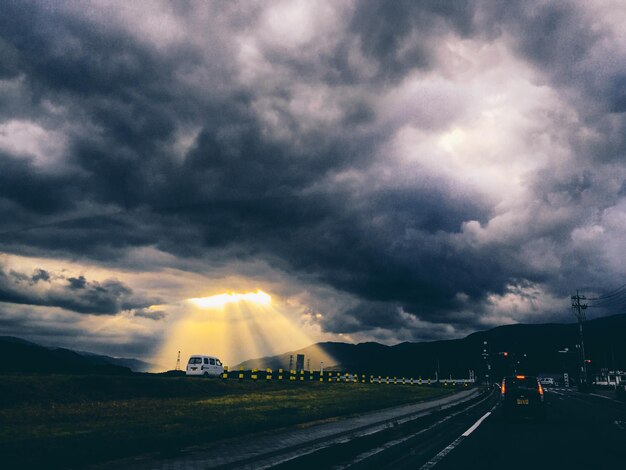 View of road against cloudy sky