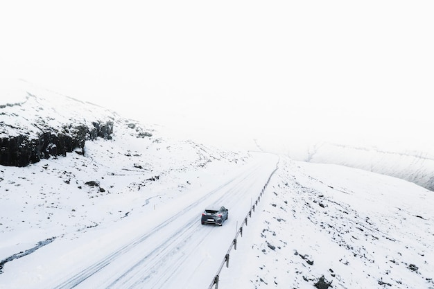 View of a road and fields covered in snow