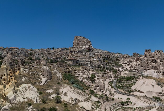 View of rock formation against clear blue sky