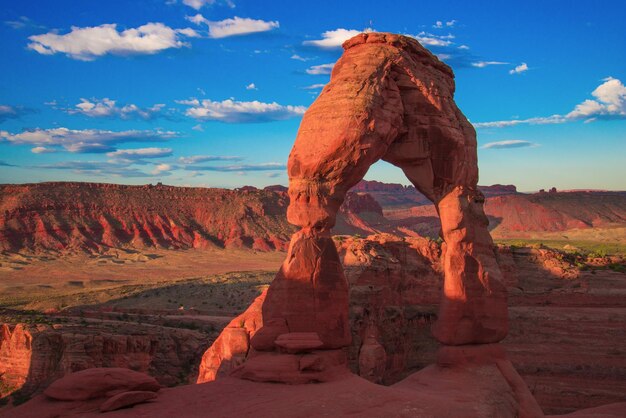 View of rock formation against cloudy sky