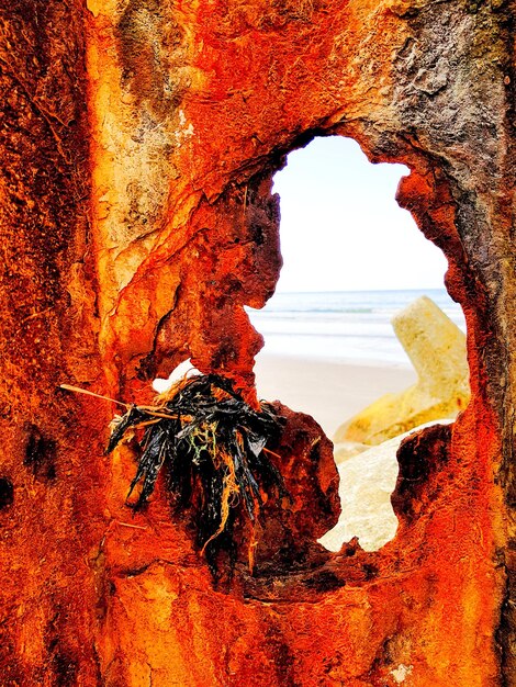 View of rock formations through cave