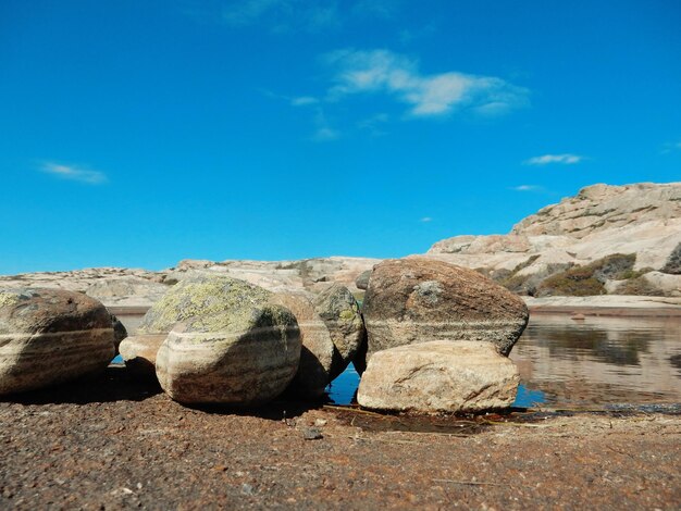 View of rocks against blue sky