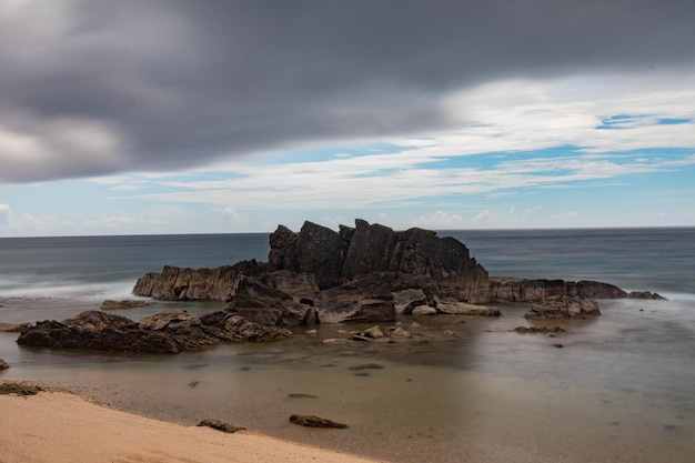 View of the rocks on the shore against the background of the sea