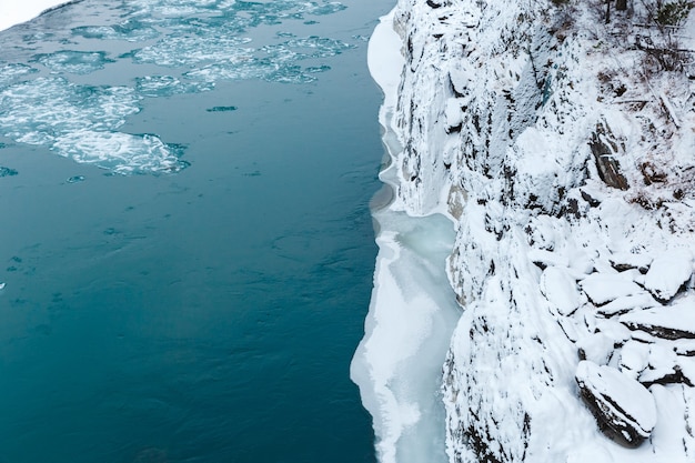 View of rocks, stones and ice in the river at winter