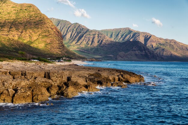 View of rocky coastline in warm evening sunlight, Oahu island, Hawaii