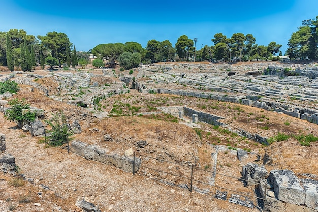 View of the Roman amphitheatre of Syracuse iconic landmark in the archaelogical park of Syracuse Sicily Italy