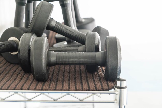 View of rows of dumbbells on a rack